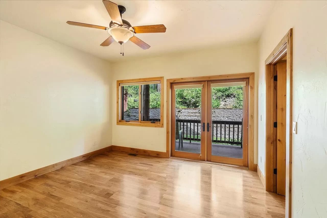 Bedroom with French doors to the covered deck