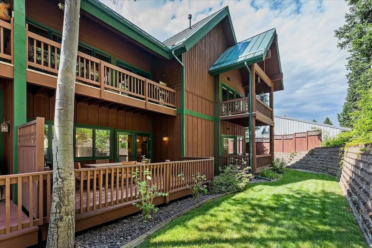 Timber and green-roof exterior with wraparound decks