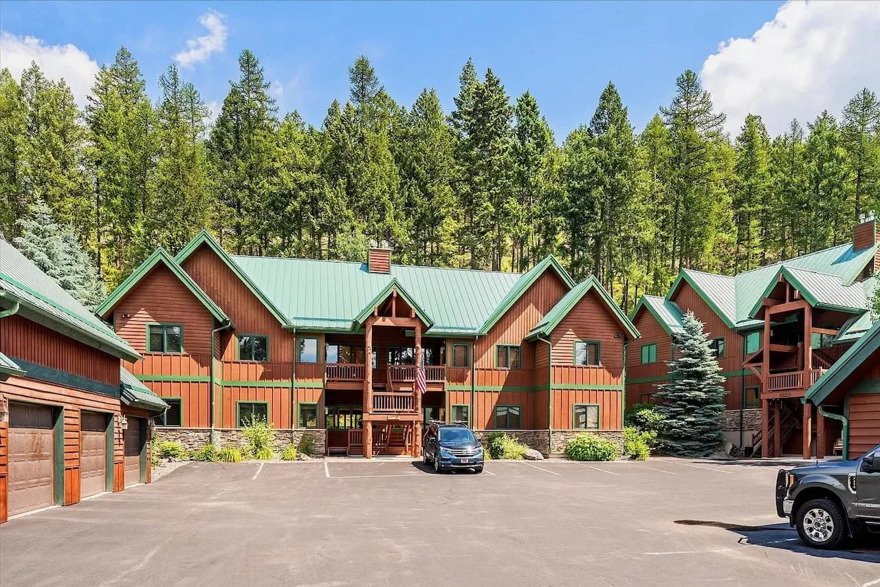 Lodge-style condo community surrounded by forest