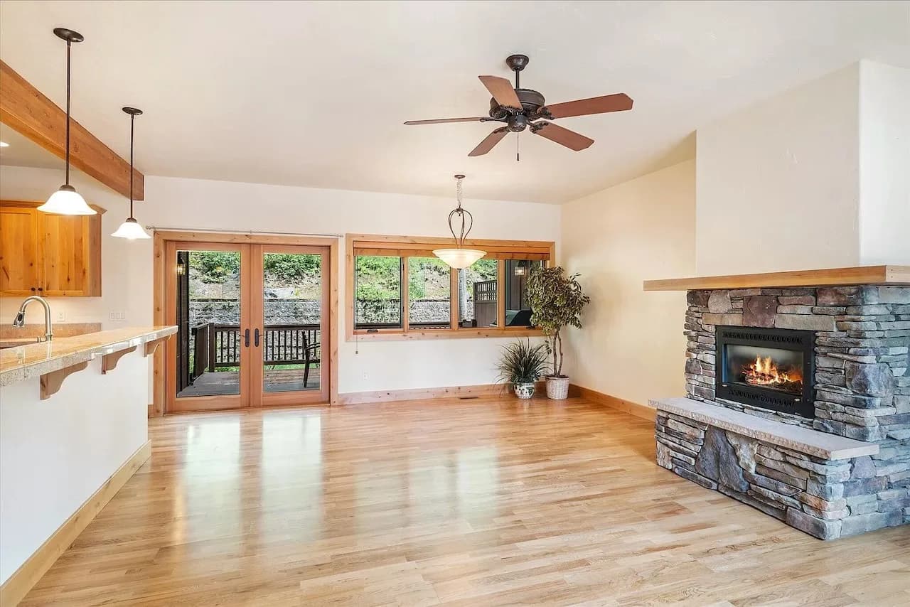 Open living with French doors to the deck