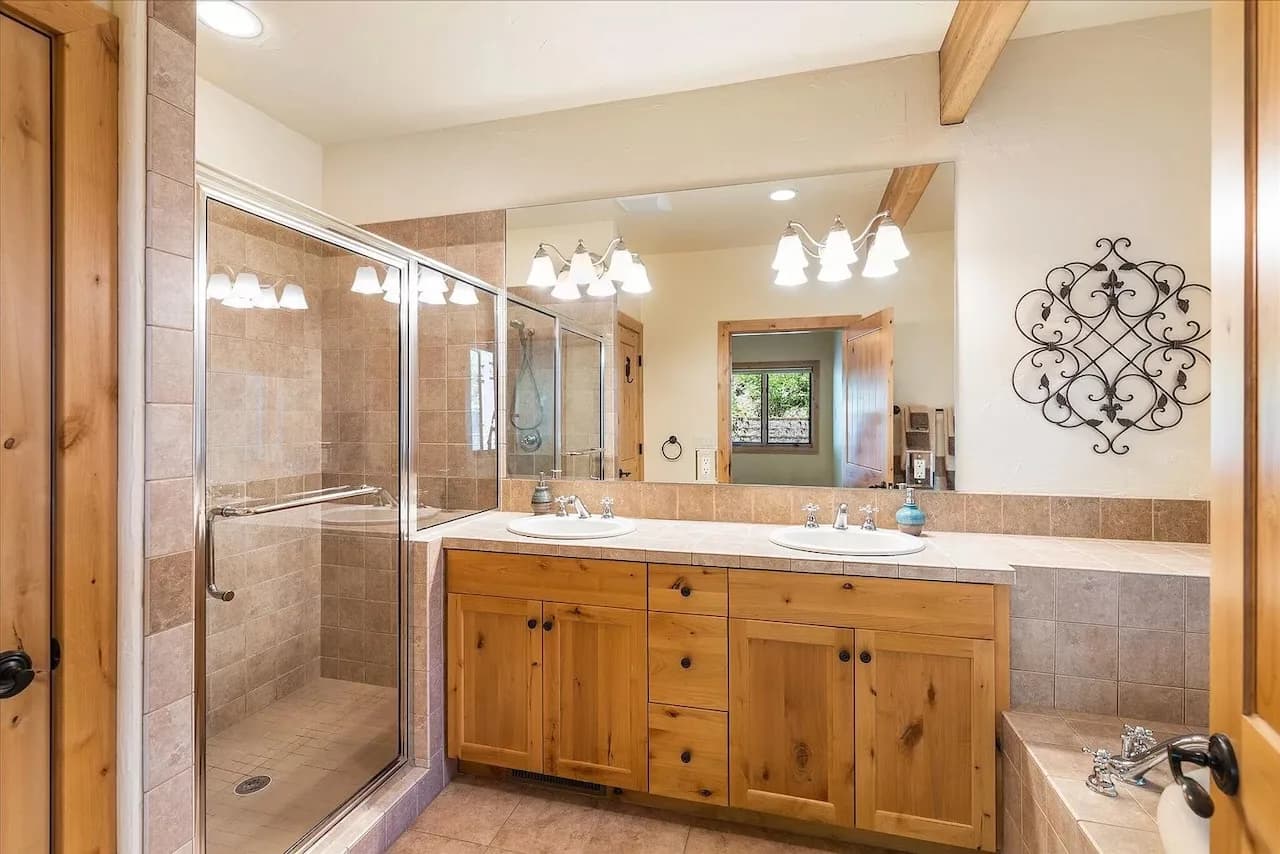 Spa-style primary bath with soaker tub and walk-in shower